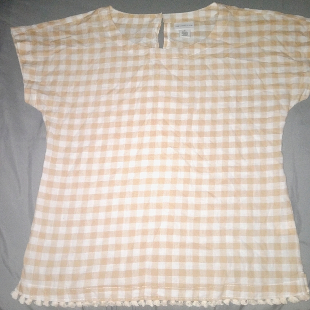 Blouse.  Short sleeve. Small tassels on the bottom looks new